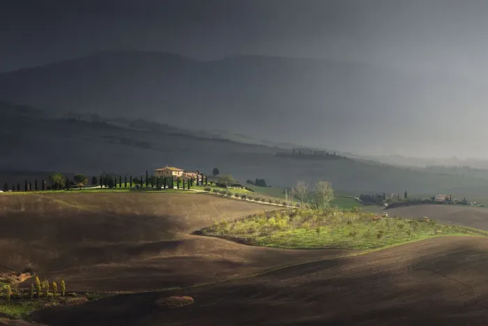 Framed Print : sunlight during a rain storm on a farmhouse Val d Orcia Tuscany, Italy