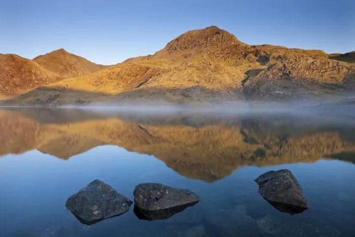 Framed Print : Sunlit Crib Goch and Snowdon mountains reflected in Llyn Llydaw, Snowdonia National Park Framed Print : Sunlit Crib Goch and Snowdon mountains reflected in Llyn Llydaw, Snowdonia National Park