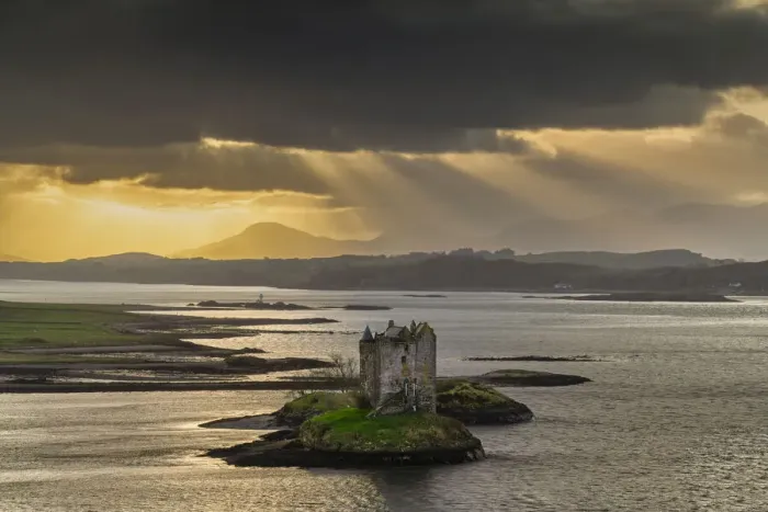 Framed Print : Sunrays over Castle Stalker, Appin, Argyll & Bute, Scotland Framed Print : Sunrays over Castle Stalker, Appin, Argyll & Bute, Scotland