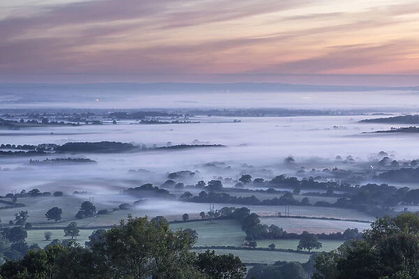 Sunrise over the Blackmore Vale from Bullbarrow Hill, Dorset, England, UK