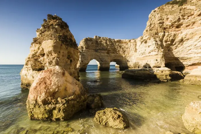 Framed Print : Sunrise on the cliffs and turquoise water of the ocean Praia da Marinha Caramujeira Framed Print : Sunrise on the cliffs and turquoise water of the ocean Praia da Marinha Caramujeira
