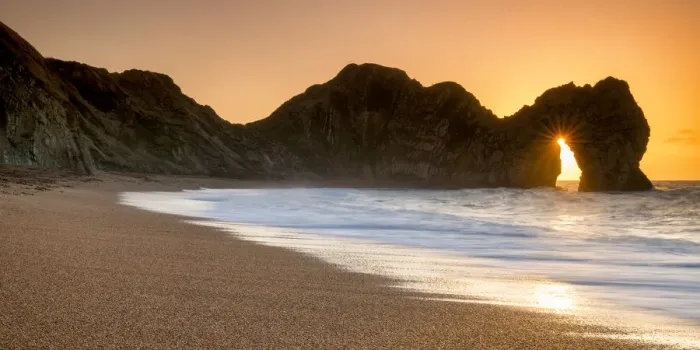 Framed Print : Sunrise Through Durdle Door, Dorset, England Framed Print : Sunrise Through Durdle Door, Dorset, England