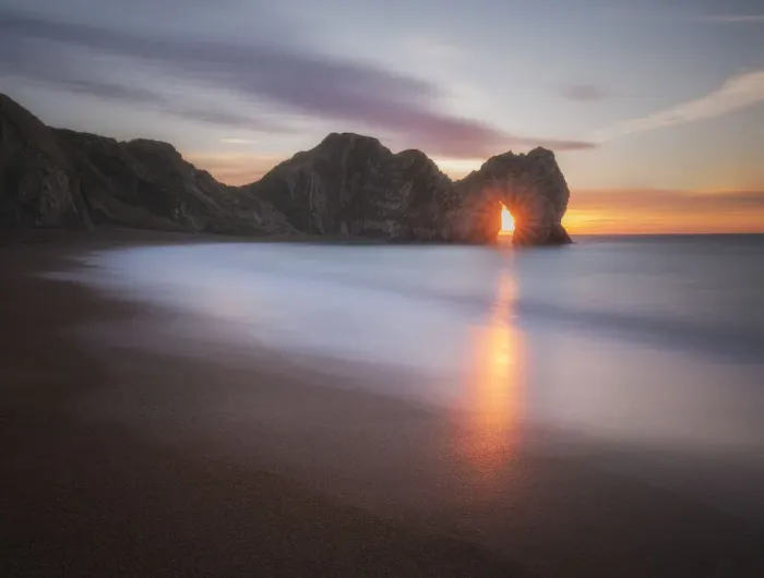 Framed Print : Sunrise through Durdle Door, Jurassic Coast, Dorset, England, UK Framed Print : Sunrise through Durdle Door, Jurassic Coast, Dorset, England, UK