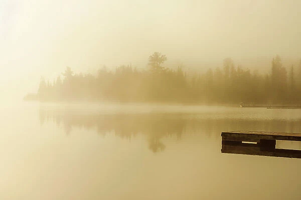 Sunrise and fog on Lyons Lake Whiteshell Provincial Park, Manitoba, Canada