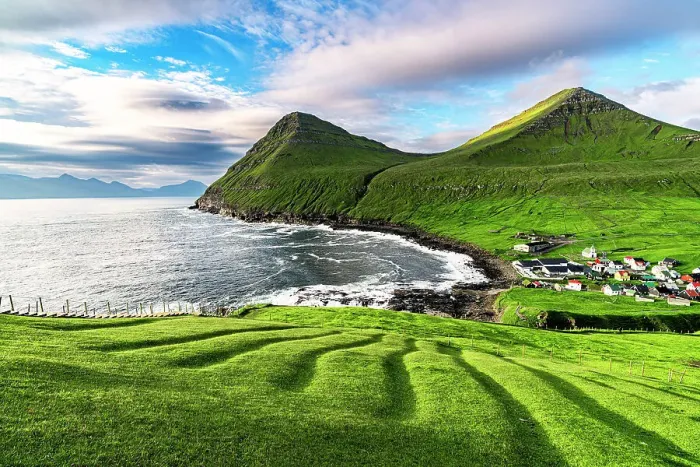 Framed Print : Sunrise over the green hills surrounding the village of Gjogv washed by the ocean, Eysturoy island, Faroe Islands Framed Print : Sunrise over the green hills surrounding the village of Gjogv washed by the ocean, Eysturoy island, Faroe Islands