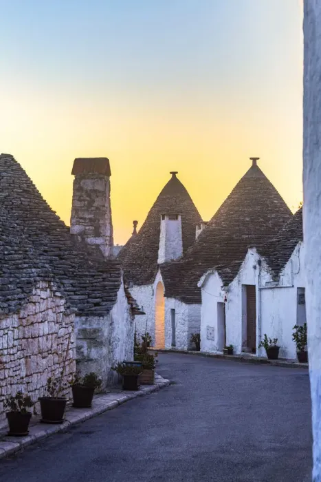 Framed Print : The sunrise illuminates sky above monumental trulli area