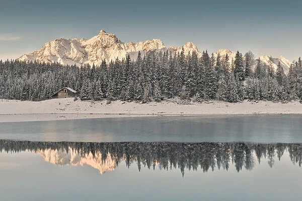 Sunrise on Lake Palu after an early snowfall Malenco Valley Valtellina Lombardy Italy Europe