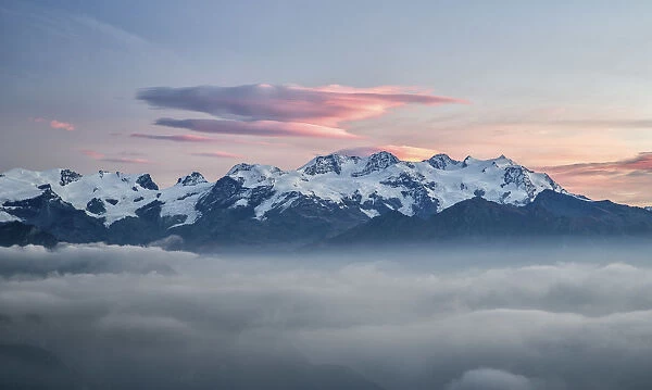 The sunrise lights coloring the Mount Rosa range, from its highest peak, Punta Dufour