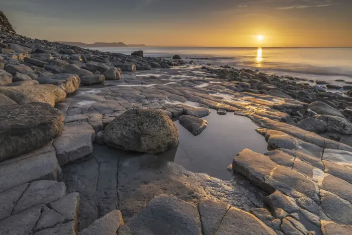 Framed Print : Sunrise over Lyme Bay from the Ammonite Pavement, Lyme Regis, Dorset, England. Winter (February) 2022 Framed Print : Sunrise over Lyme Bay from the Ammonite Pavement, Lyme Regis, Dorset, England. Winter (February) 2022