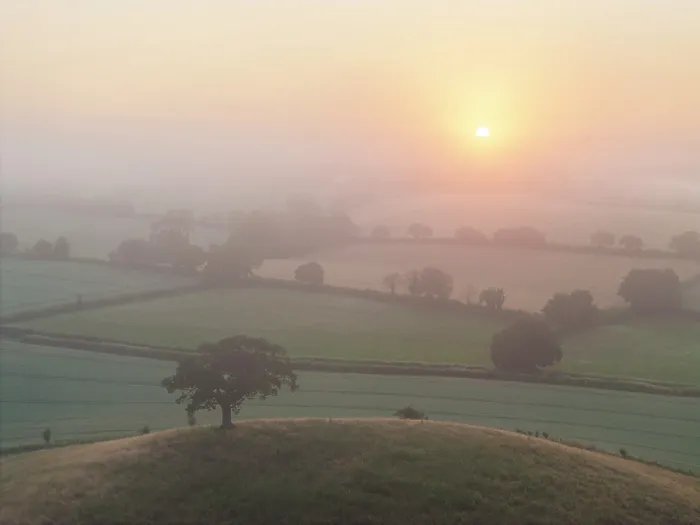 Framed Print : Sunrise over misty summer countryside, Mid Devon, England
