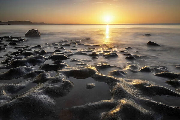 Sunrise from Monmouth Beach, Lyme Regis, Jurassic Coast World Heritage Site, Dorset, England, UK