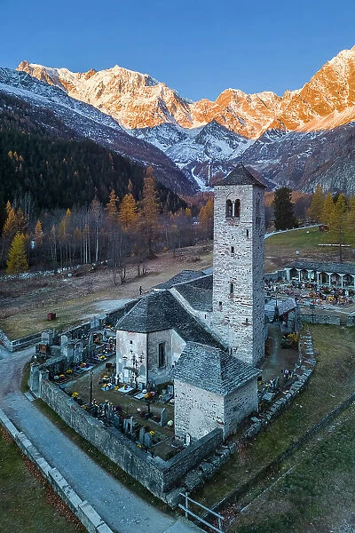 Sunrise in front of Monte Rosa from the old church of Macugnaga. Valle Anzasca, Ossola, province of Verbania, Piedmont, italian alps, Italy