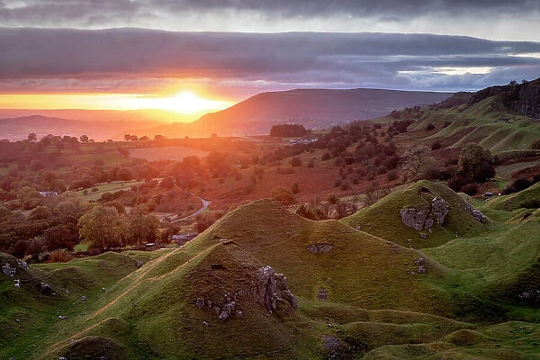 Sunrise over the old quarry on the Llangattock Escarpment, Brecon Beacons National Park, Powys, Wales. Autumn (October) 2021