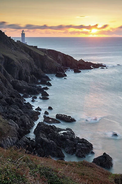 Sunrise over Start Point Lighthouse in the South Hams, Devon, England. Autumn (September) 2020