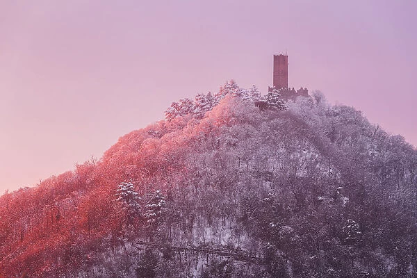Sunset on Baradello tower (Castel Baradello) after the snowfall, Como city, lake Como