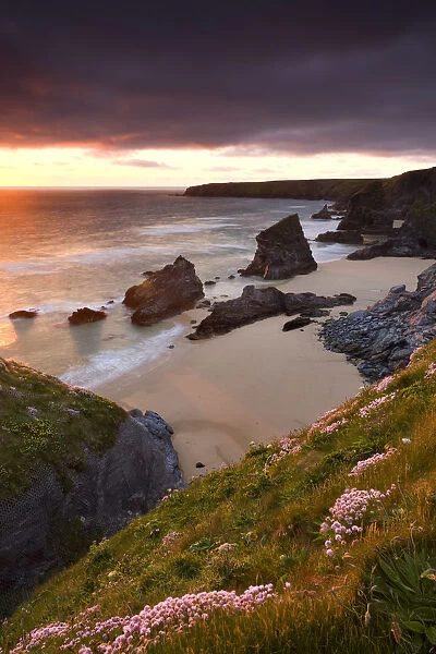 Sunset over Bedruthan Steps, North Cornwall, England. Spring (May) 2009