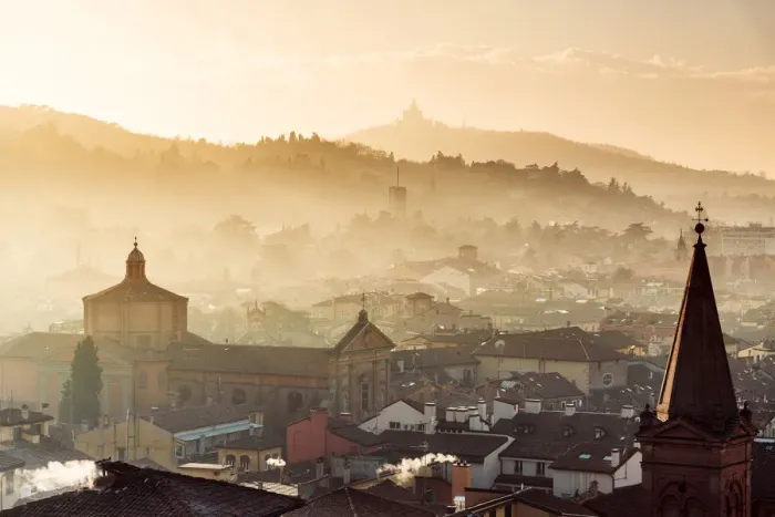 Framed Print : Sunset in Bologna, rooftops and hills in background with Santuario di San Luca