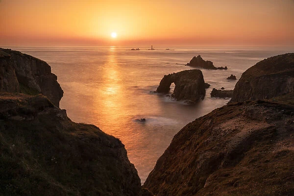 Sunset over Enys Dodnan, Armoured Knight and Longships Lighthouse, Lands End, Cornwall