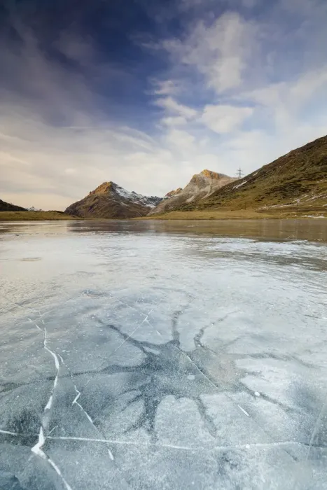 Framed Print : Sunset on the frozen Lej Nair surrounded by rocky peaks Bernina Pass Canton of Graubunden