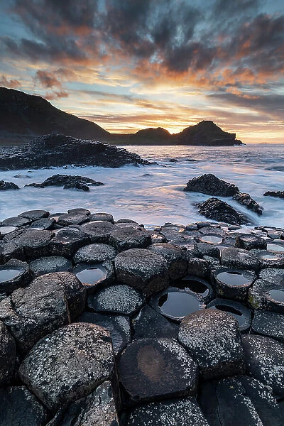 Sunset over the Giant's Causeway in Country Antrim, Northern Ireland, UK. Autumn (November) 2022