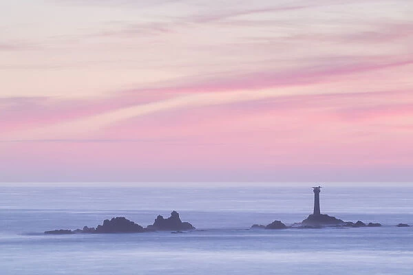 Sunset over Longships Lighthouse at Lands End, Cornwall, England