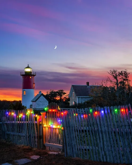 Framed Print : sunset over Nausert Beach Lighthouse with holiday lights on beach fence, Cape Cod, Eastham, Massachusetts, USA Framed Print : sunset over Nausert Beach Lighthouse with holiday lights on beach fence, Cape Cod, Eastham, Massachusetts, USA