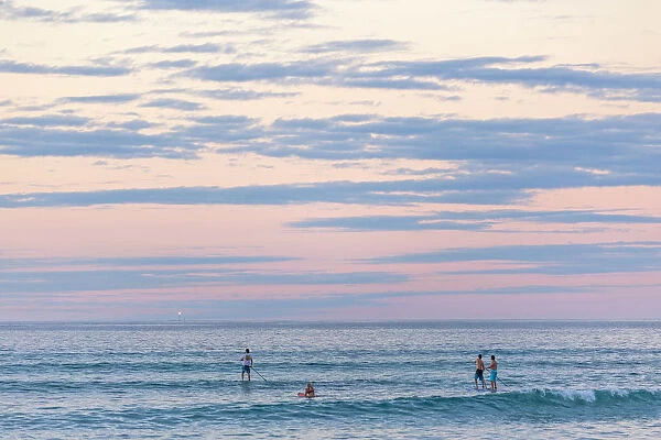 Sunset at Ningaloo Marine Park, surfers. Western Australia