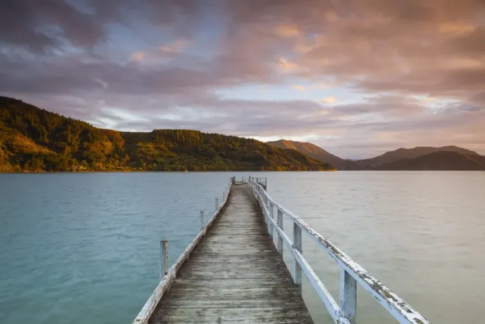 Framed Print : Sunset over picturesque wharf in idyllic Kenepuru Sound, Marlborough Sounds, South Island Framed Print : Sunset over picturesque wharf in idyllic Kenepuru Sound, Marlborough Sounds, South Island