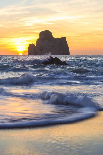 The sunset is reflected on the Beach of Masua, Iglesias, Sud Sardegna province, Sardinia