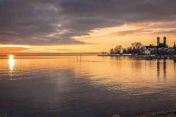 Sunset on the shore of Lake Constance from Friedrichshafen with the Castle Church, Baden-Wurttemberg, Germany