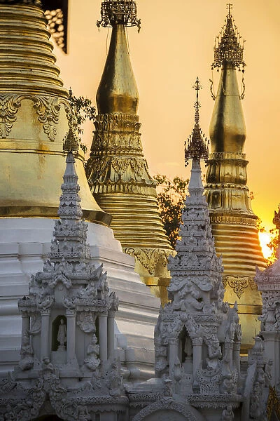 Sunset behind temples of Shwedagon Pagoda, Yangon, Myanmar