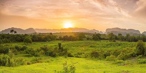Sunset over the tobacco plantations and limestone hills (Mogotes) of the Vinales