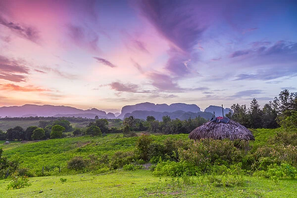 Sunset over the tobacco plantations and limestone hills (Mogotes) of the Vinales Valley