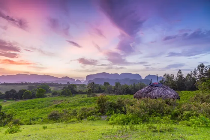 Framed Print : Sunset over the tobacco plantations and limestone hills (Mogotes) of the Vinales Valley