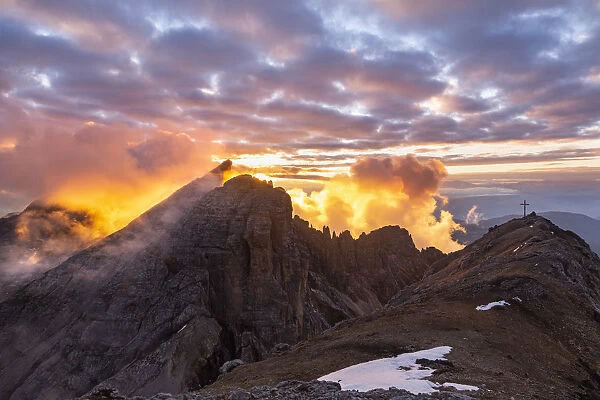 Sunsetscape of Dolomites mountains with Cimon del Latemar peak from Schenon mount