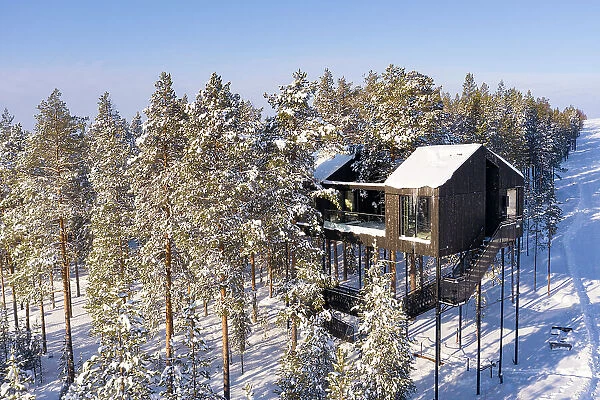 Suspended luxury wood suite built among treetops in the snow, Tree hotel, Harads, Lapland, Sweden