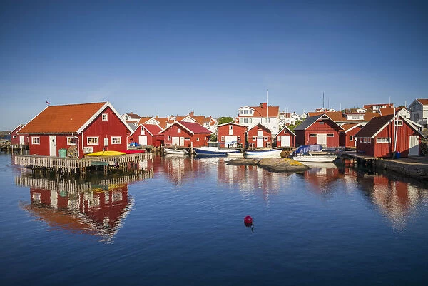 Sweden, Bohuslan, Kungshamn, red fishing shacks in the Fisketangen