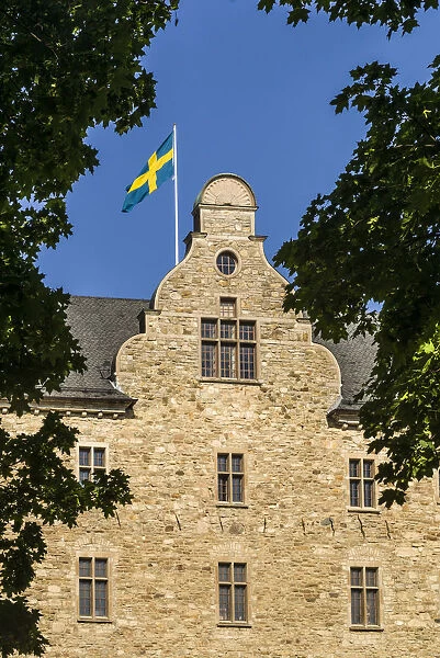 Sweden, Narke, Orebro, Orebro Slottet Castle, with Swedish flag