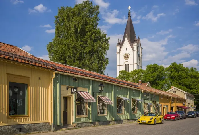 Framed Print : Sweden, Vastmanland, Nora, traditional wooden buildings along the main street with Framed Print : Sweden, Vastmanland, Nora, traditional wooden buildings along the main street with
