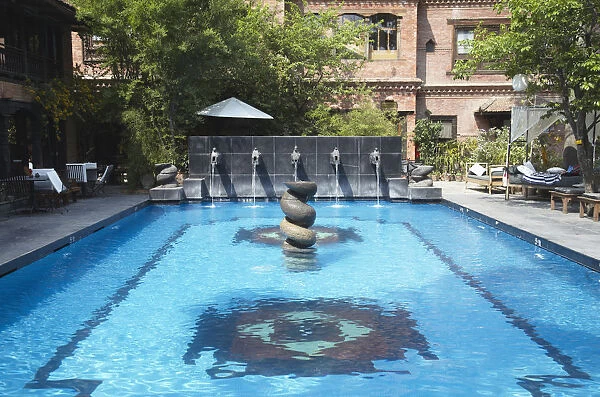 Swimming pool in grounds of Dwarikas Hotel, Kathmandu, Nepal