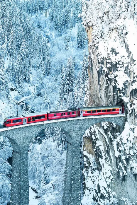 Framed Print : Swiss red train running on Landwasser viaduct from a tunnel carved on steep mountain, Filisur, Graubunden canton, Switzerland Framed Print : Swiss red train running on Landwasser viaduct from a tunnel carved on steep mountain, Filisur, Graubunden canton, Switzerland