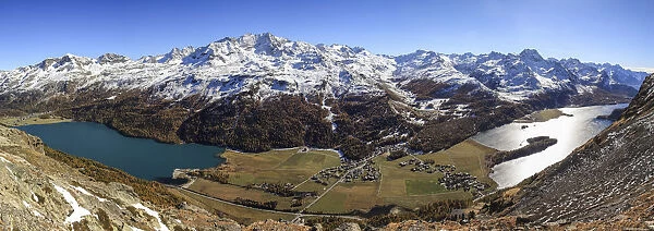 Switzerland, Engadine, Sils lake at Silvaplana lake in autumn. Corvatsch peak snowy