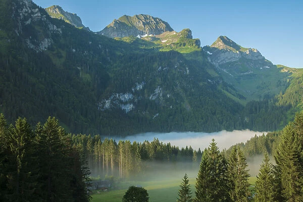 Switzerland, St. Gallen, Grabs, Voralp, Gamsberg and fog over Voralpsee