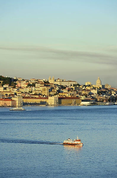 The Tagus river (Tejo river) and the historic centre of Lisbon in the evening. Portugal