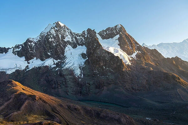 Takusiri mountain (5350 m) and Laguna Pucacocha in Andes at sunrise, near Uchullujllo, Pitumarca district, Canchis Province, Cuzco Region, Peru