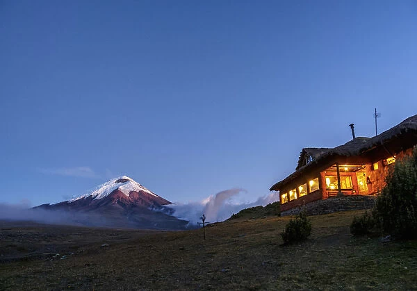 Tambopaxi Mountain Shelter and Cotopaxi Volcano at twilight, Cotopaxi National Park