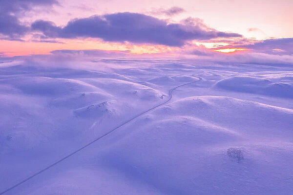 Tanafjordveien road during a winter sunset (Tana, Troms og Finnmark, Norway)