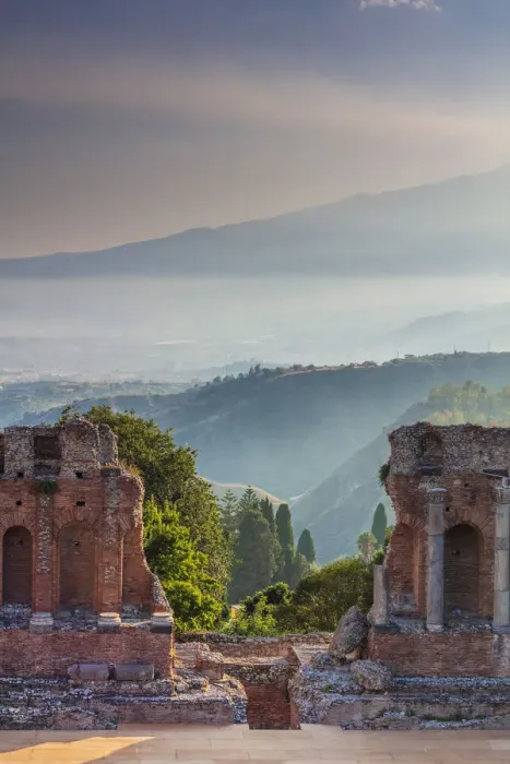 Framed Print : Taormina, Sicily. Sun setting on the greek theater with Etna volcano in the background