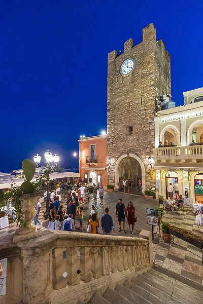 Taormina, Sicily Tourists visiting the main square by night