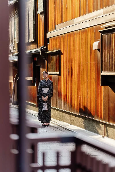 Teen dressed as geisha on the streets of Gion, Kyoto, Japan